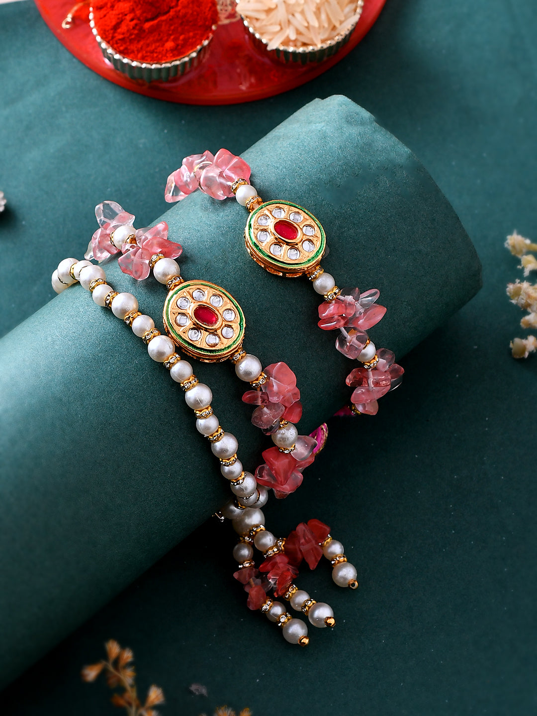 Pink Stones & Pearl Embellished Dazzling Bhaiya Bhabhi Rakhi Set.