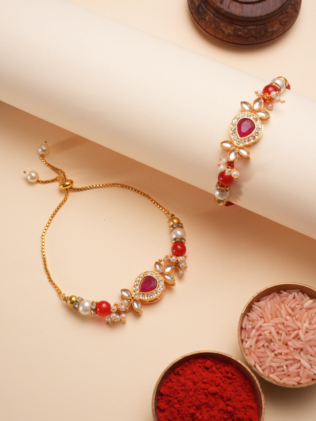 Handcrafted Kundan Teardrop Rakhi With Crimson Beads And Pearls