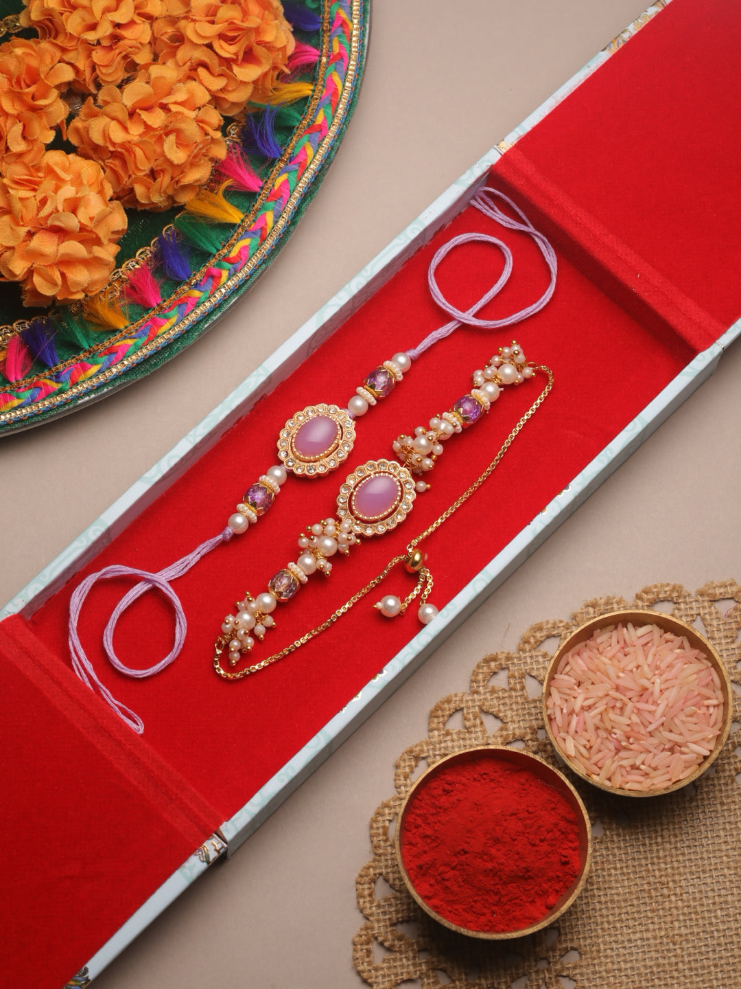 Regal Oval Stone Bhaiya Bhabhi Rakhi Set Embellished With Lustrous Seed Pearls Filigree