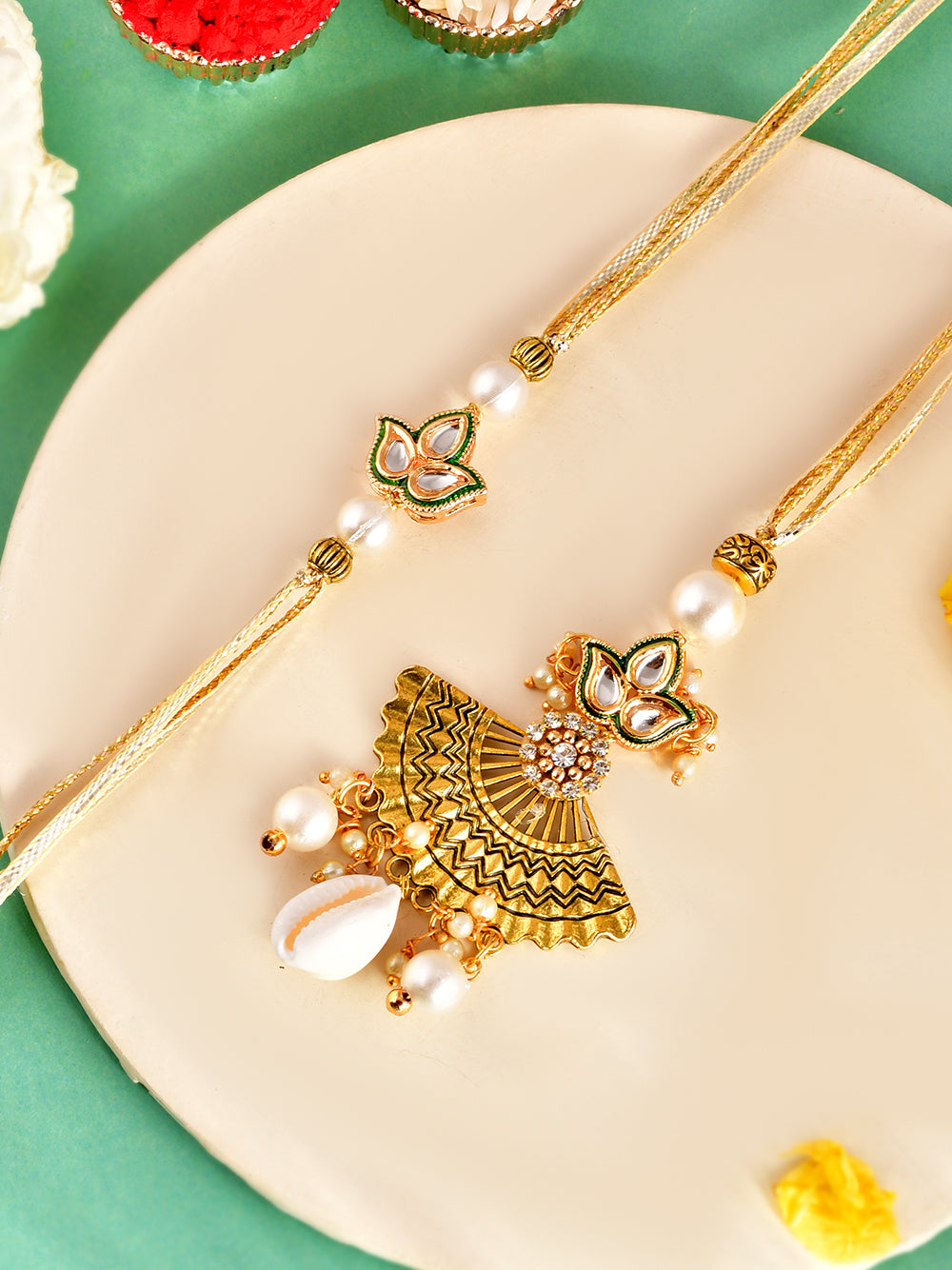 Festive Pearl Drop Rakhi Set with Elegant Kundan Charm