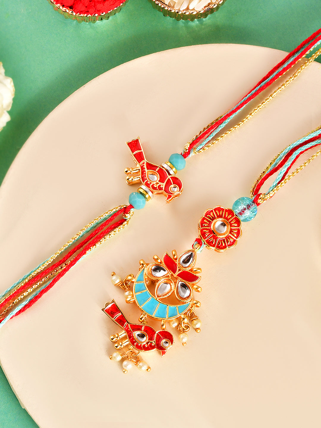 Festive Handcrafted Rakhi Pair with Meenakari Art and Pearl Drops