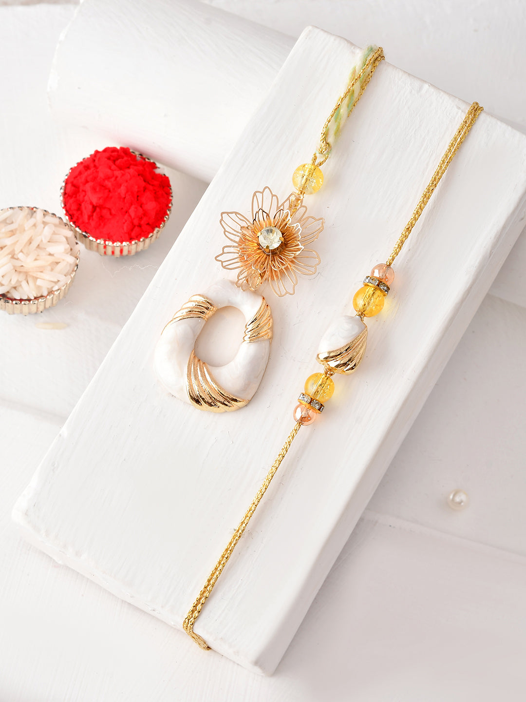 Handpicked Rakhi Pair with White Beads and Golden Floral Details