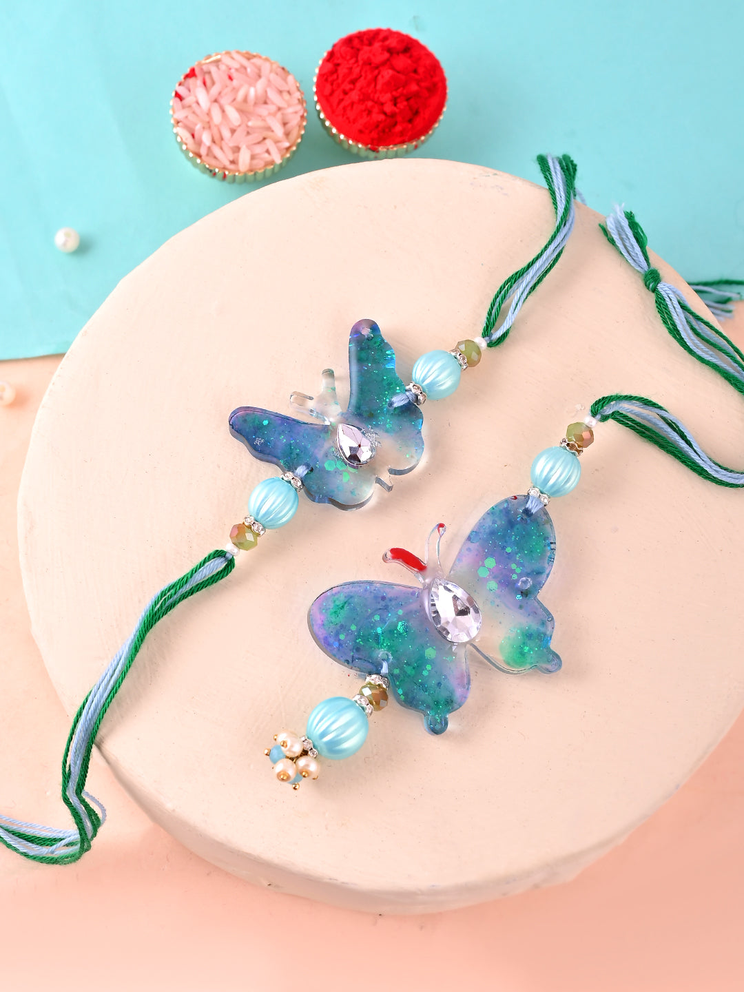 Glitter Resin Butterfly Rakhi Pair with Pastel Beads