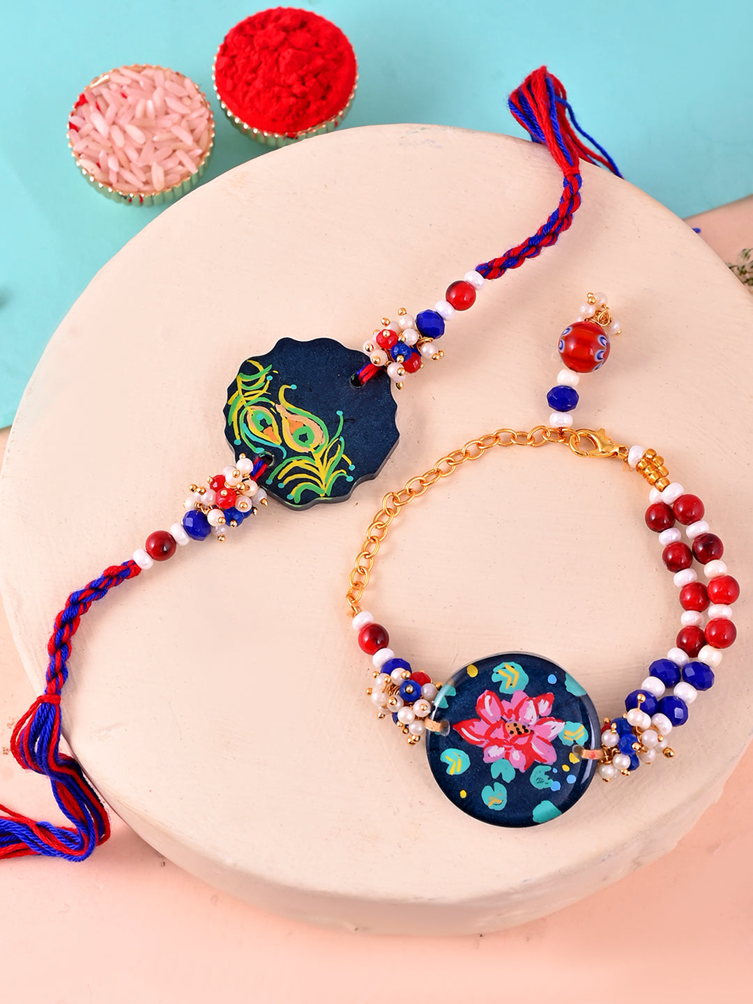 Handpainted Ethnic Resin Bhaiya Bhabhi Rakhi with Lotus and Peacock Motifs