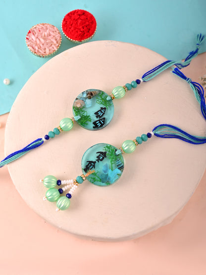 Scenic Nature-Inspired Resin Rakhi Set with Mint Green Beads