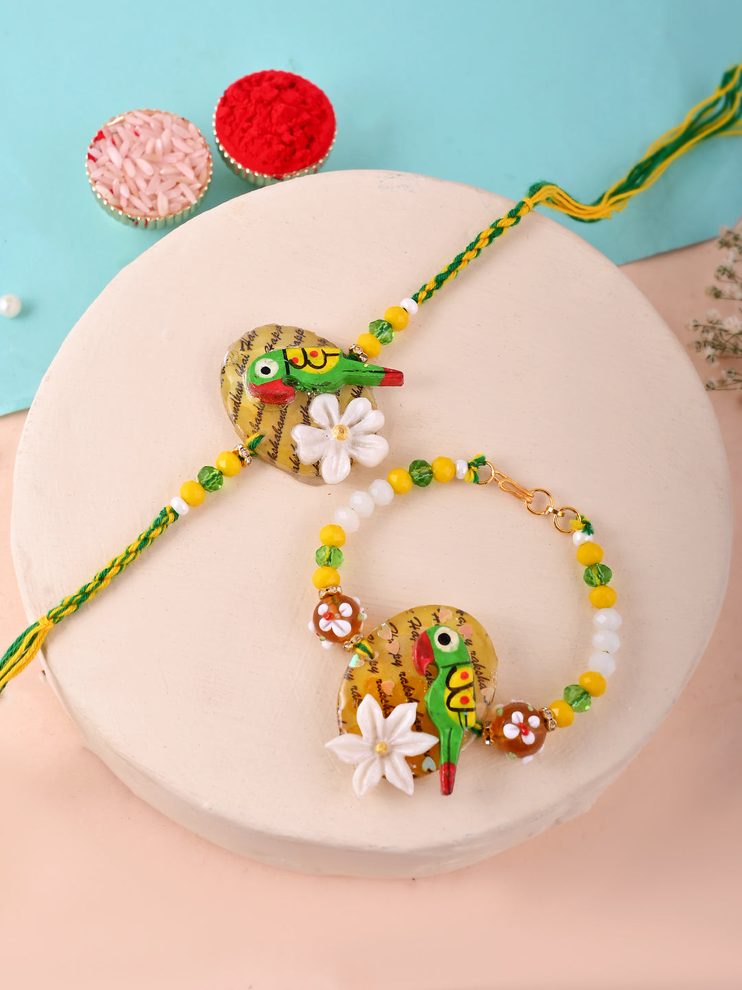 Handcrafted Parrot and Floral Resin Rakhi Set in Yellow Green Tones