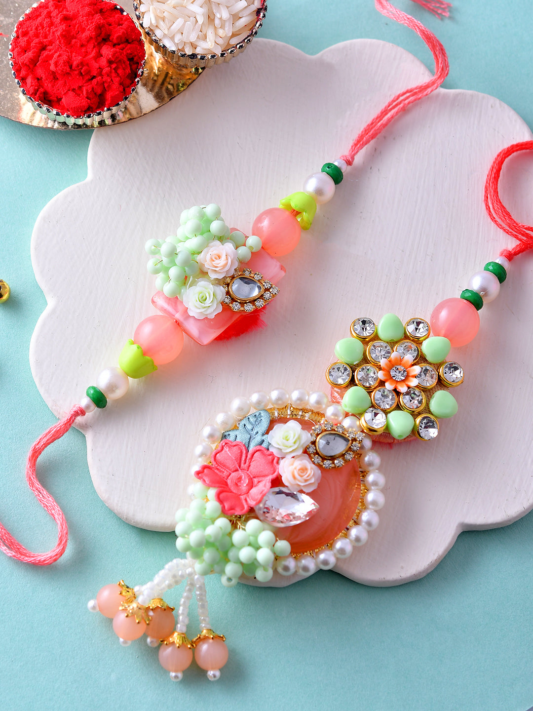 Floral Pearl Bhaiya Bhabhi Rakhi Set with Pastel Accents and Beaded Charm