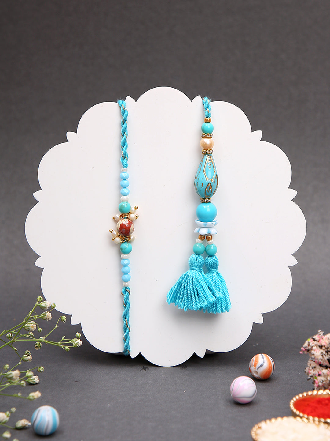 Handcrafted Rakhi Set with Blue Threadwork and Teardrop Beads