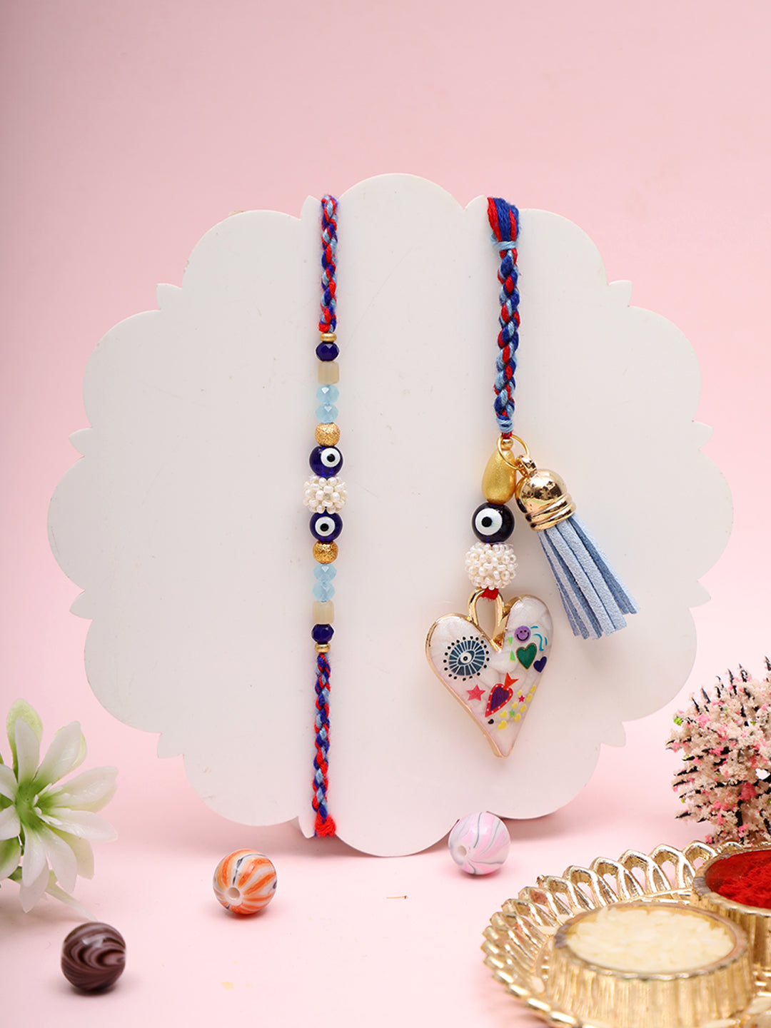 Nazar Suraksha Rakhi Set with Floral Heart and Blue Tassel