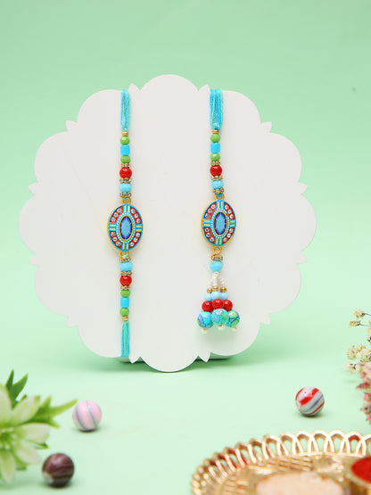 Vibrant Blue Bhaiya Bhabhi Rakhi Set With Art Deco Inspired Oval Motifs with Box