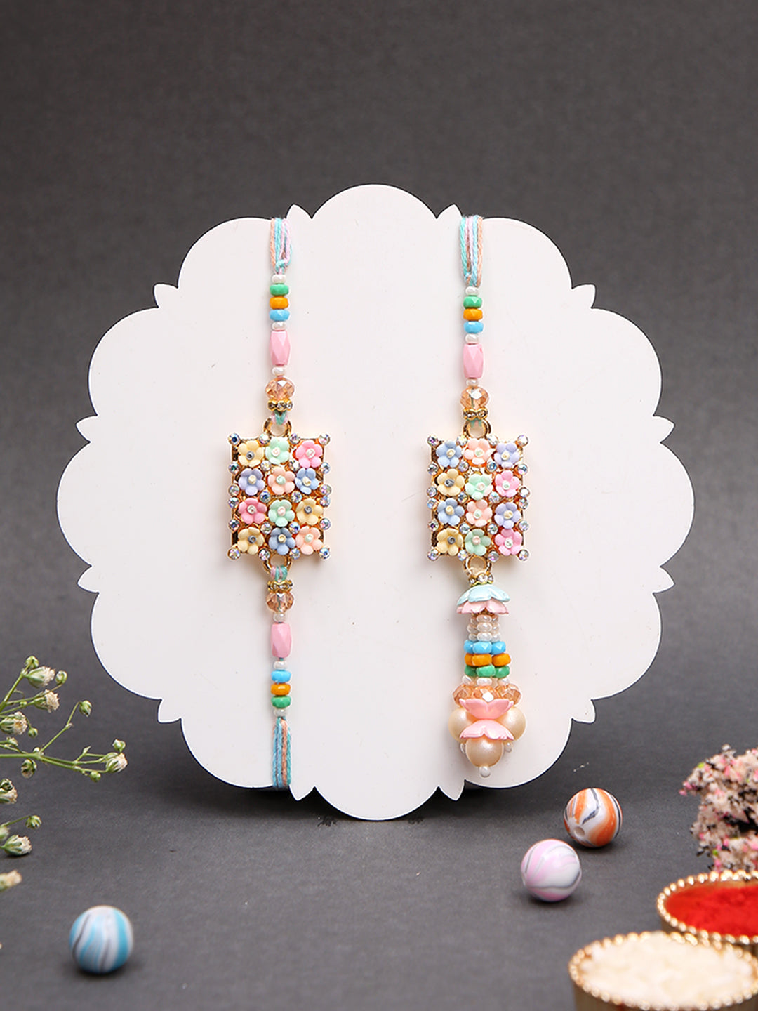 Phoolon Wali Rakhi Set with Pastel Pearls and Beaded Tassel