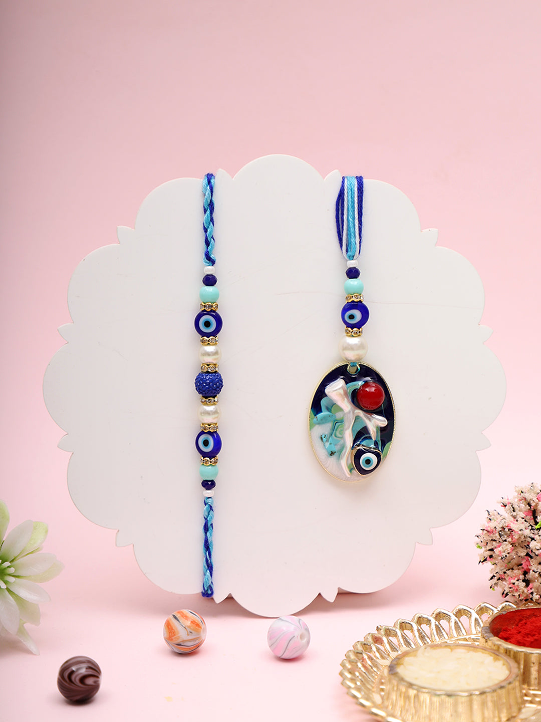 Evil eye Rakhi set with a golden designer thali
