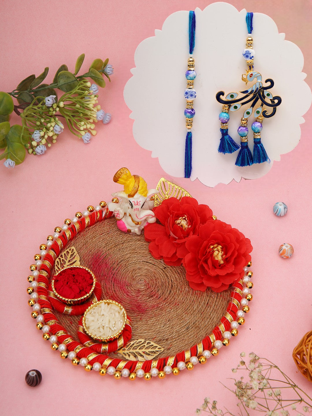 Blue peacock Rakhi duo with floral Ganesh thali