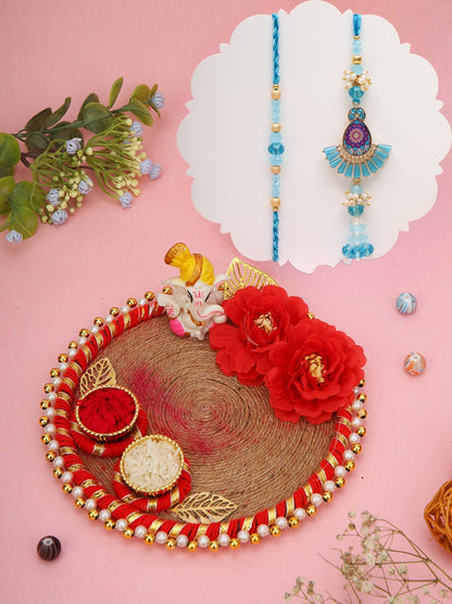 Blue Rakhi with fan-shaped locket and jute thali