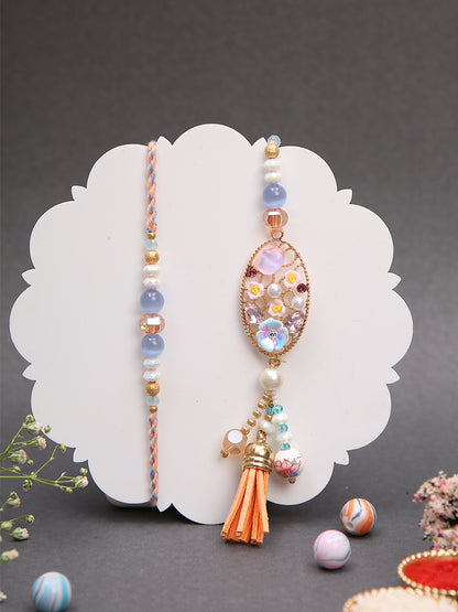 Soft-toned Rakhi set with peach accents and jute thali