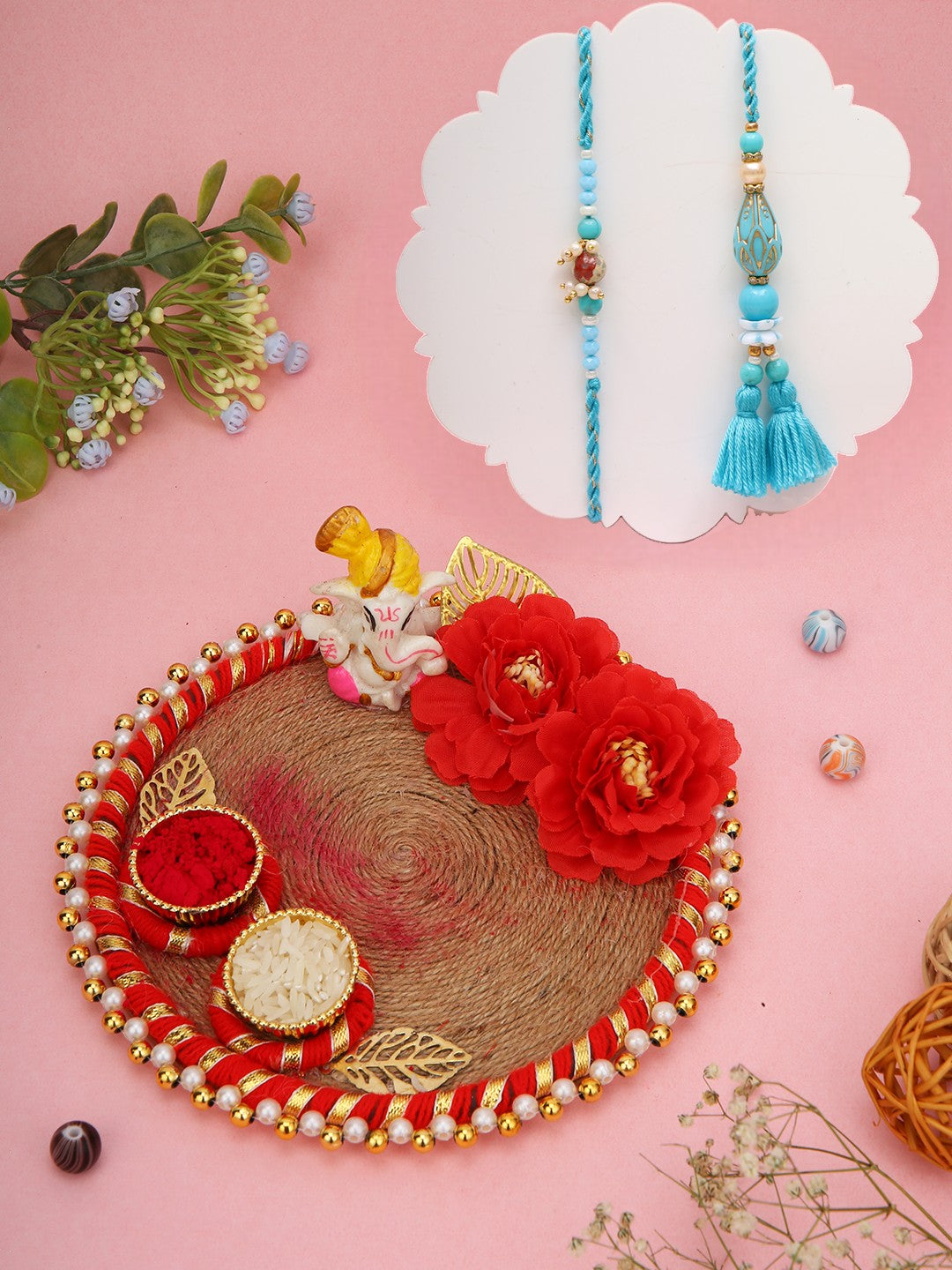 Elegant blue Rakhi set with jute Ganesh thali