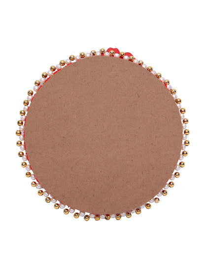 Soft-toned Rakhi set with peach accents and jute thali