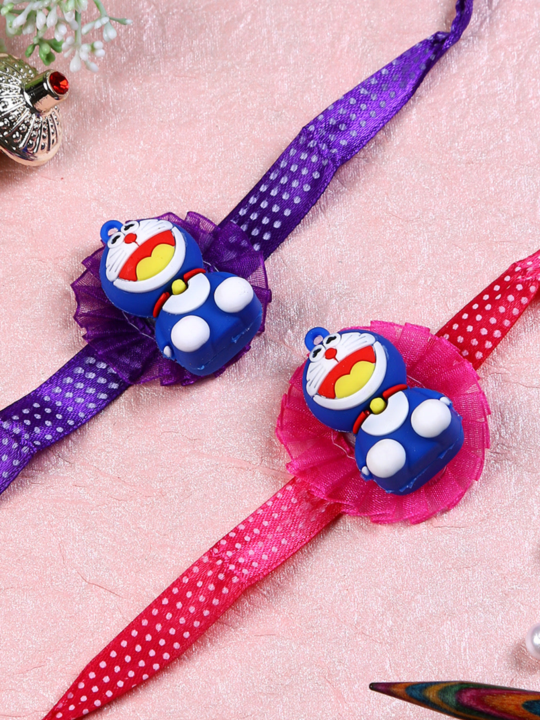 Doraemon in Flower Rakhi Set of Two - Only Rakhi (PST22686_2)