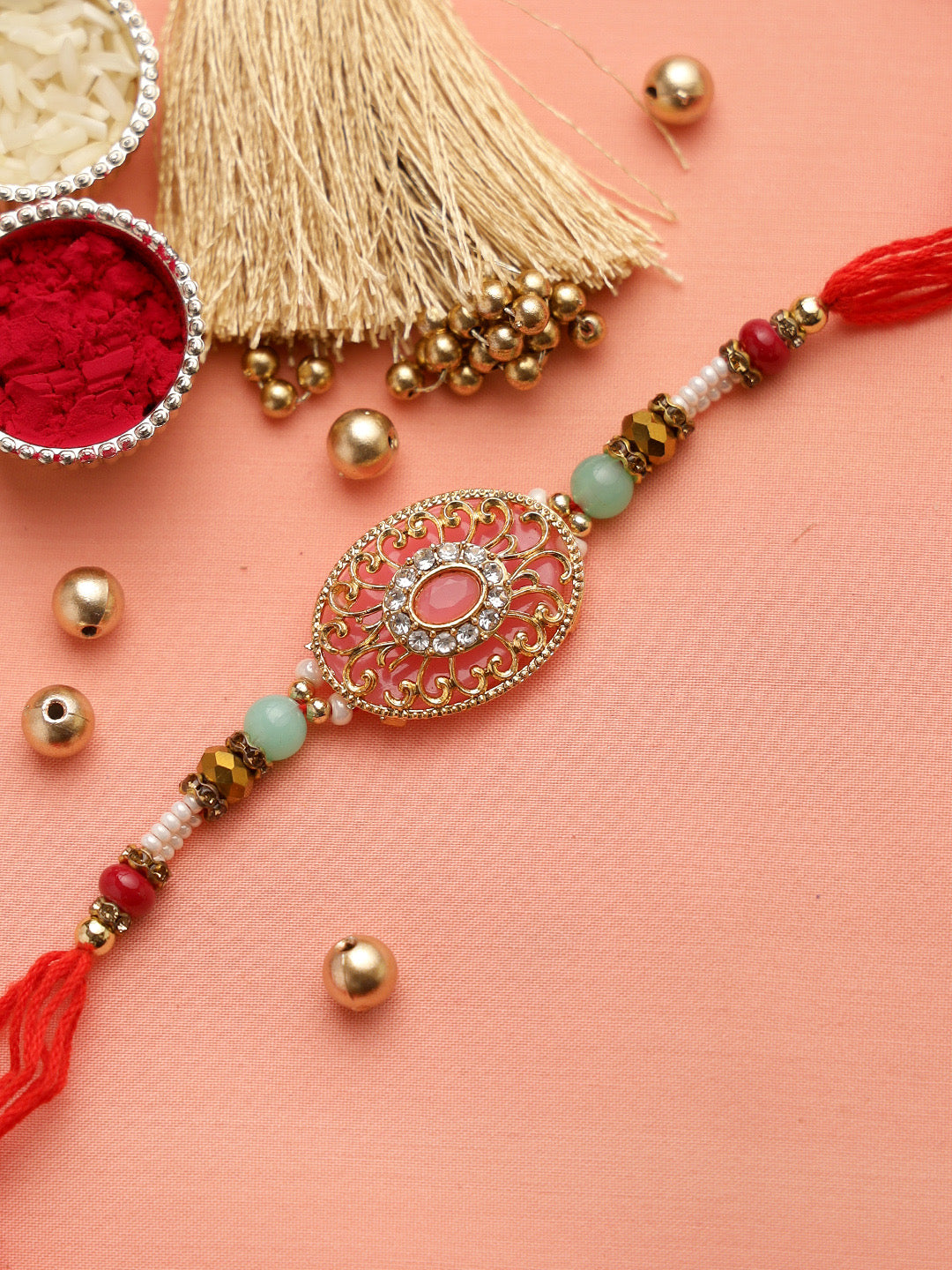 Golden Filigree work Jewelled Rakhi with Red and White Beads - Only Rakhi (RJ22143)
